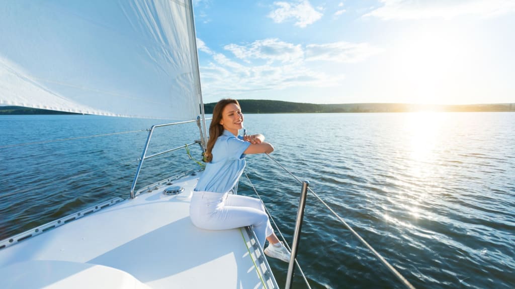 woman sitting taking a Sailing Tour